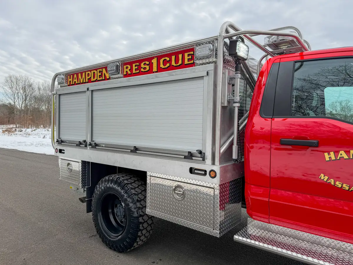 Passenger-side profile with closed roll-up compartment doors.